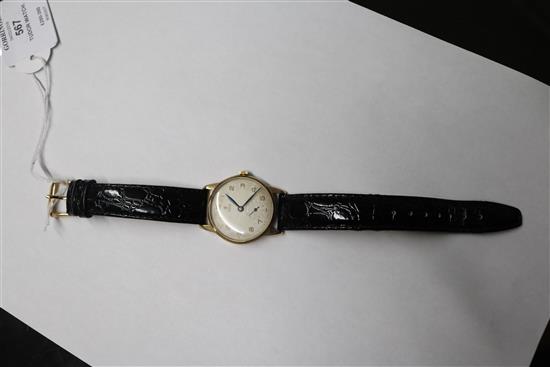 A gentlemans 9ct gold Tudor manual wing wrist watch, with subsidiary seconds, on later associated strap.